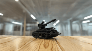 Miniature black tank model on wooden surface